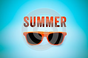 Summer orange text message and orange sunglasses isolated in vignetting blue background photo