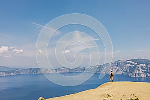 Summer outdoor adventure, man standing with a panoramic view