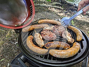 Summer outdoor BBQ meat and hotdogs