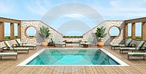 Summer outdoor swimming pool with sunbed and stone wall