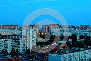 Summer panorama of residential areas of the city in the early morning from a height of the 16th floor.