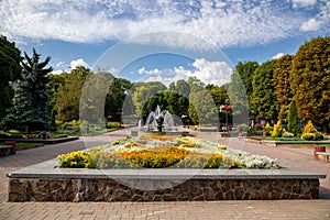 Summer park in the city of Khmelnytskyi. Square with a fountain