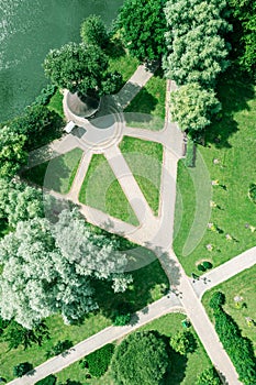 Summer park landscape with green trees, lawn and footpaths. aerial photo