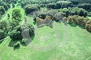 Summer park landscape with green trees, lawn and walking paths. aerial view