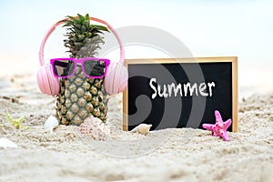 Summer in the party. Hipster Pineapple Fashion in sunglass and listen music