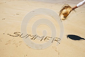 Summer people travel holiday vacation concept with young caucasian beautiful woman at the beach enjoying the sun with the word
