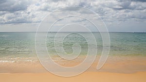 Summer photo of beach sea wave sand sky and clouds at tropical sea. Kata beach, Phuket Island, Thailand