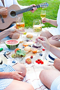 Summer Picnic Basket on the Green Grass. Food and drink concept.