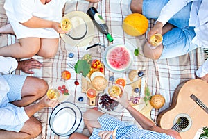 Summer Picnic Basket on the Green Grass. Food and drink concept.