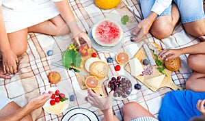 Summer Picnic Basket on the Green Grass. Food and drink concept.