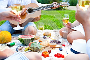 Summer Picnic Basket on the Green Grass. Food and drink concept.