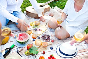 Summer Picnic Basket on the Green Grass. Food and drink concept.