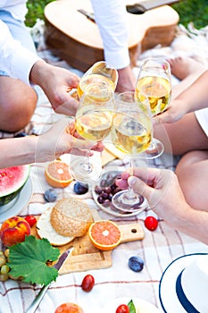 Summer Picnic Basket on the Green Grass. Food and drink concept.