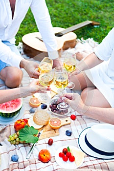 Summer Picnic Basket on the Green Grass. Food and drink concept.