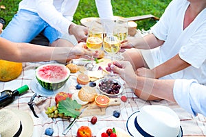 Summer Picnic Basket on the Green Grass. Food and drink concept.