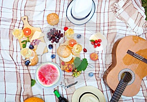 Summer Picnic Basket on the Green Grass. Food and drink concept.