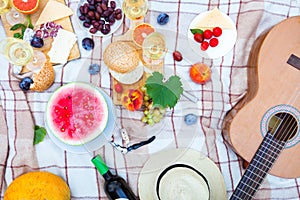 Summer Picnic Basket on the Green Grass. Food and drink concept.