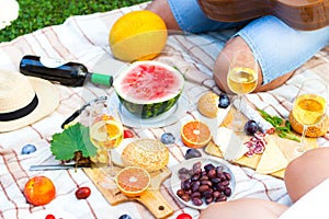 Summer Picnic Basket on the Green Grass. Food and drink concept.