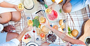 Summer Picnic Basket on the Green Grass. Food and drink concept.