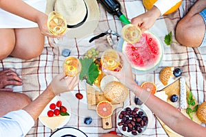 Summer Picnic Basket on the Green Grass. Food and drink concept.