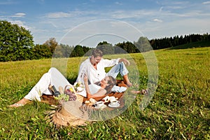 Summer picnic - Young couple relaxing in nature
