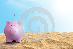 Summer piggy bank on the beach Travel money concept