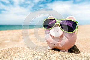 Summer piggy bank with sunglasses