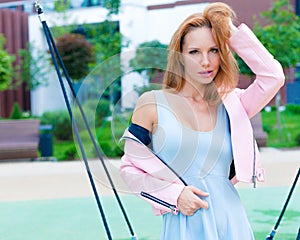 Summer portrait of a beautiful red-haired girl