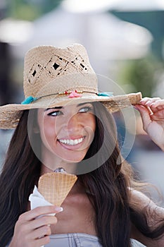 Summer portrait of beautiful woman with ice cream outdoors