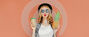 Summer portrait beautiful young woman drinking juice with pineapple fruit on a brown background