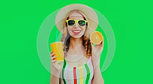 Summer portrait happy smiling young woman with fresh cup of juice and slice of orange fruit wearing a straw hat, sunglasses on