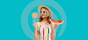 Summer portrait of happy smiling young woman with fresh juicy slice of watermelon and colorful lollipop sweet wearing straw hat,