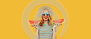 Summer portrait of happy smiling young woman with fresh juicy slice of watermelon wearing straw hat on yellow background