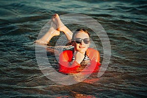 Young teenage girl having fun in the sea