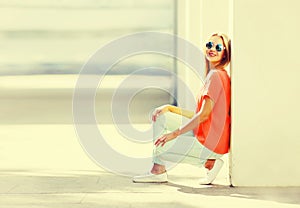 Summer portrait of stylish blonde young woman wearing sunglasses in the city