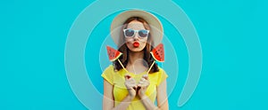 Summer portrait of stylish young woman with juicy lollipop or ice cream shaped slice of watermelon