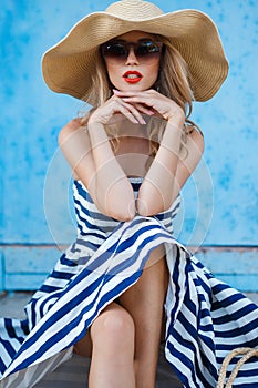Summer portrait of a woman in a straw hat