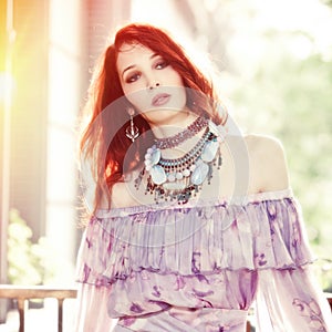 Summer portrait of young boho style woman outdoor shot