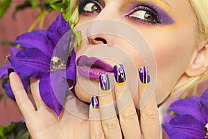 Summer purple yellow makeup and manicure .