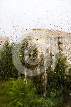 Summer rain in the city blurry background