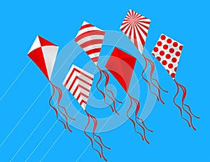 Red and white kites in the sky