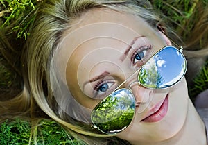 Summer reflection in sunglasses of woman