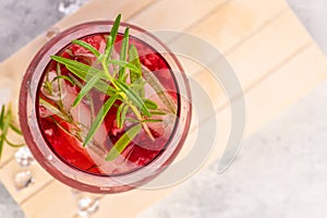 Summer refreshing cocktails made of rose wine or gin with raspberries and rosemary