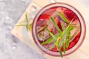 Summer refreshing cocktails made of rose wine or gin with raspberries and rosemary