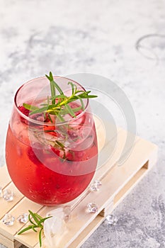 Summer refreshing cocktails made of rose wine or gin with raspberries and rosemary