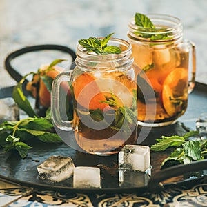 Summer refreshing cold peach ice tea, copy space