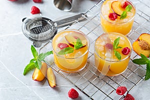 Summer refreshing drink, beverage, cocktail with peach and raspberry