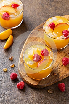 Summer refreshing drink, beverage, cocktail with peach and raspberry