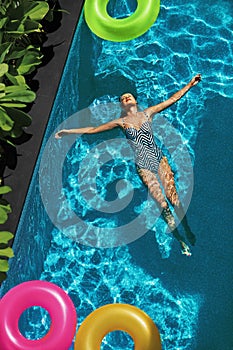 Summer Relax. Woman Floating, Swimming Pool Water. Summertime Holiday