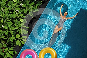 Summer Relax. Woman Floating, Swimming Pool Water. Summertime Holidays